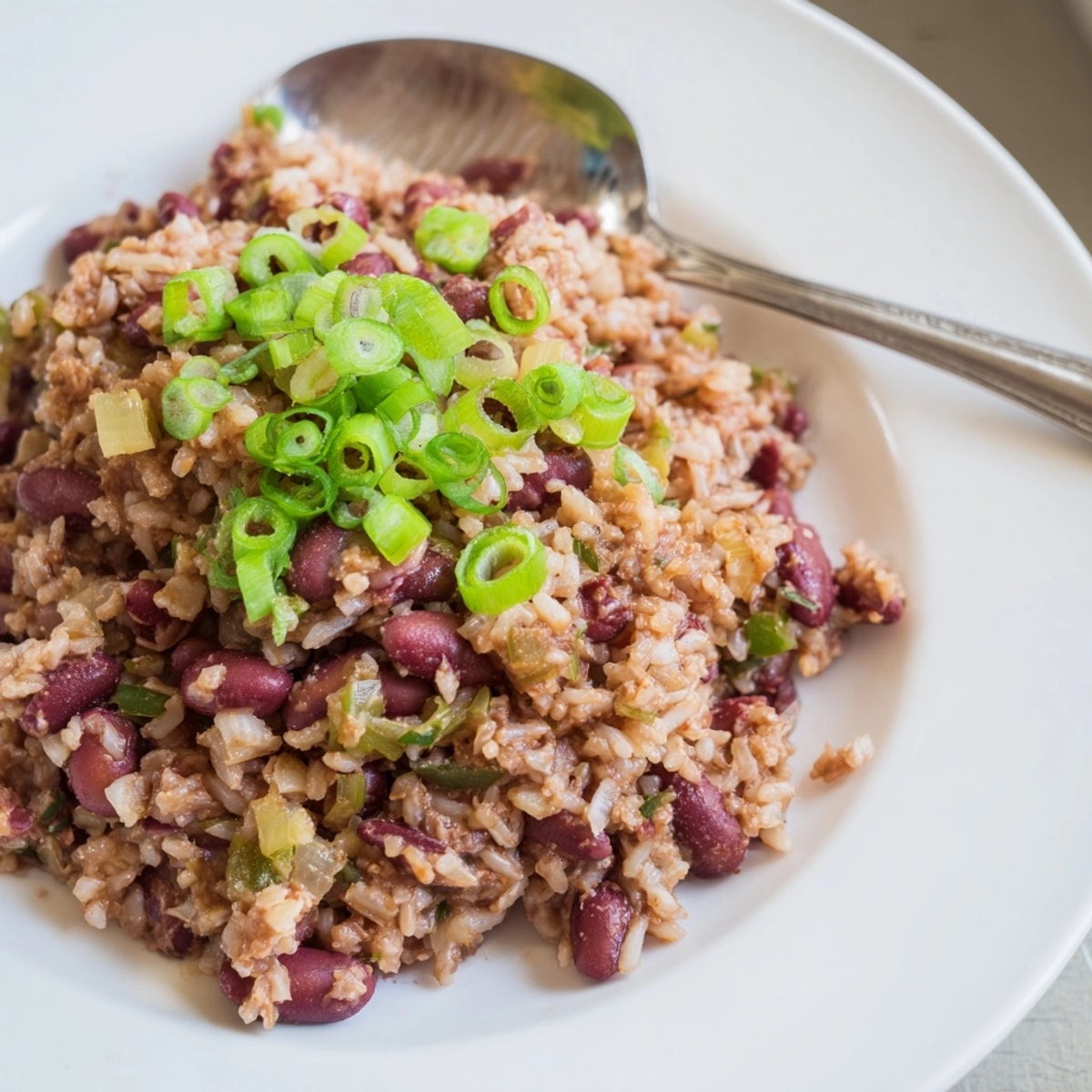 Hearty vegan Cajun Red Beans and Rice, rich with peppers and savory spices.
