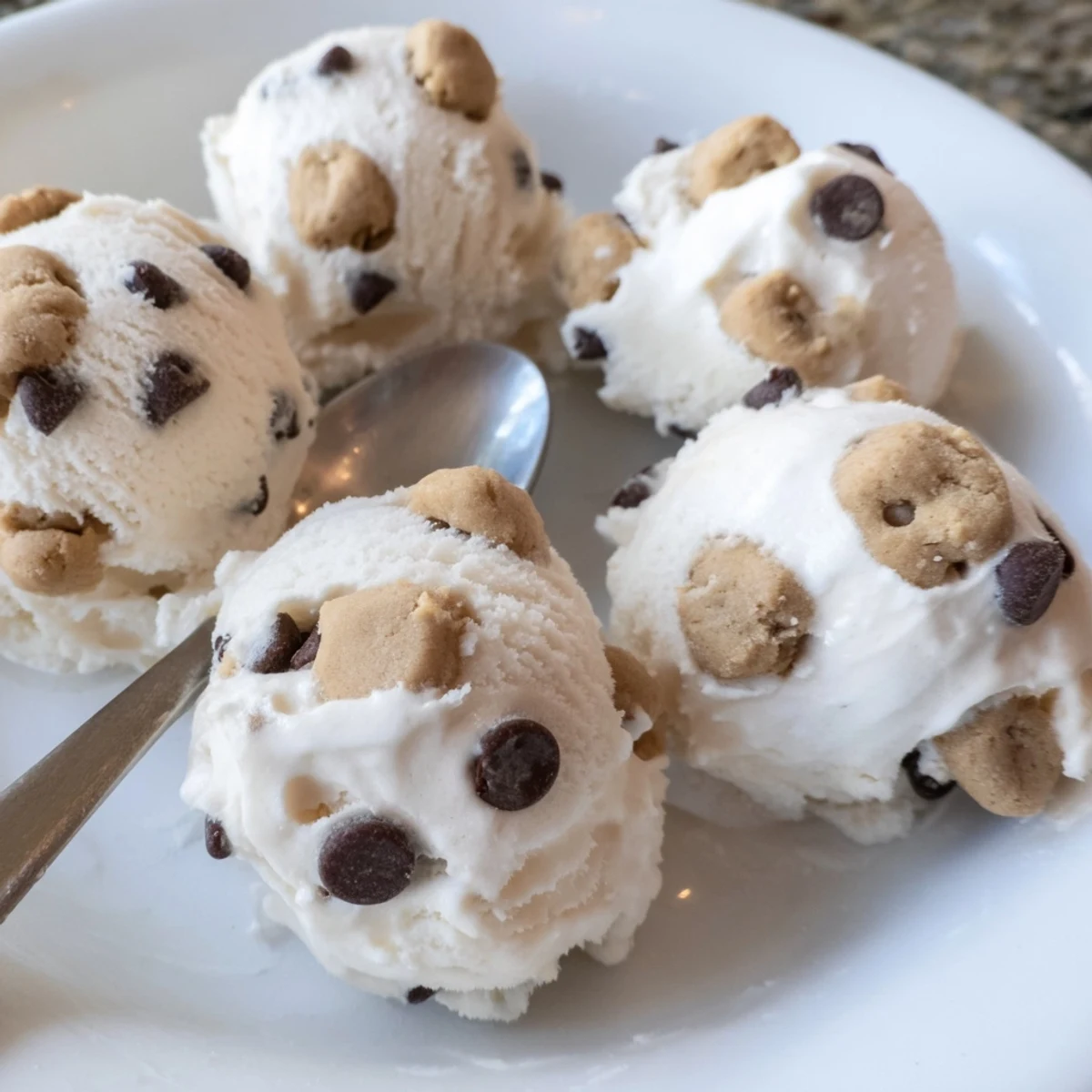 Indulge in homemade cottage cheese ice cream featuring decadent cookie dough bites.  
