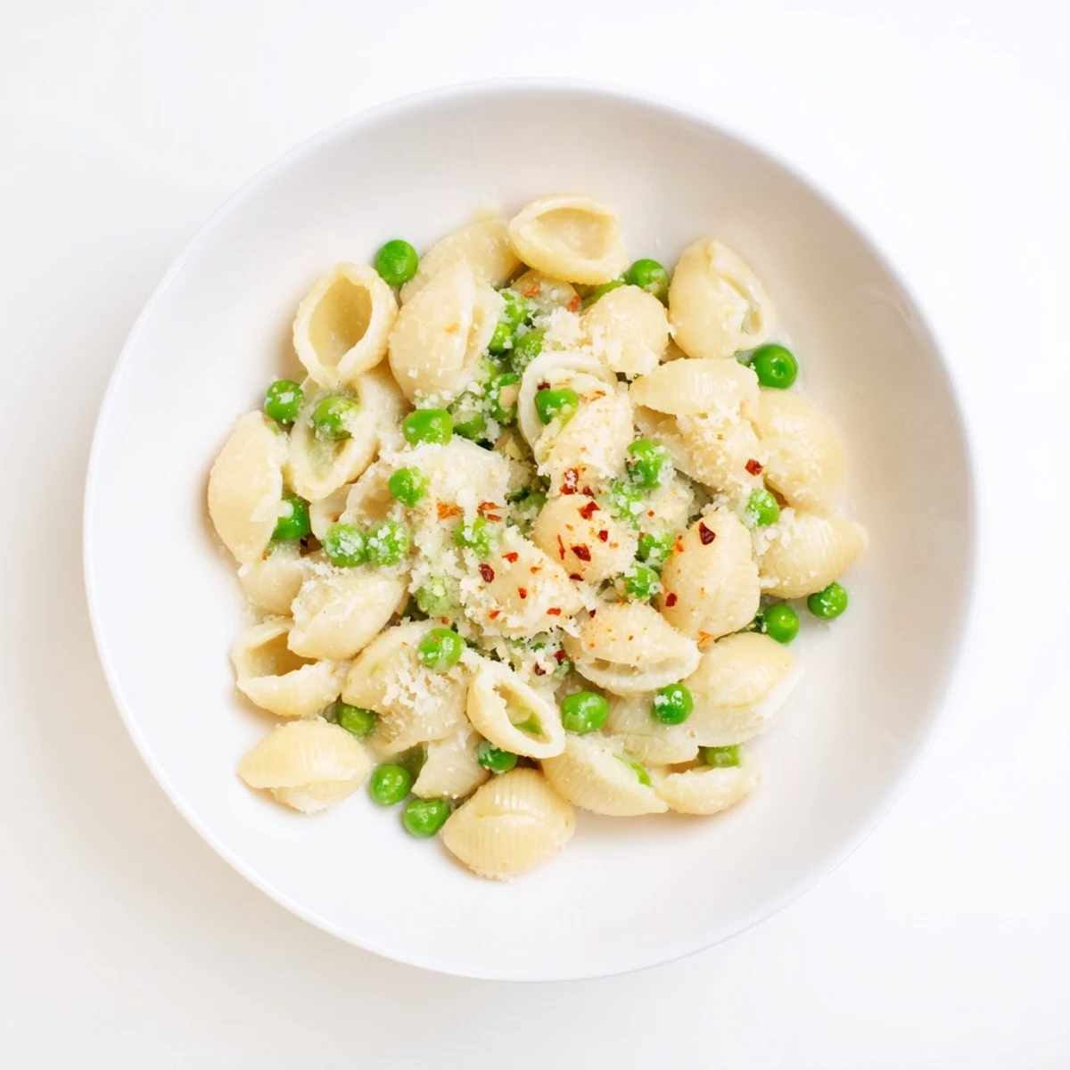 Creamy macaroni and peas, a comforting bowl with Parmesan and savory flavors.