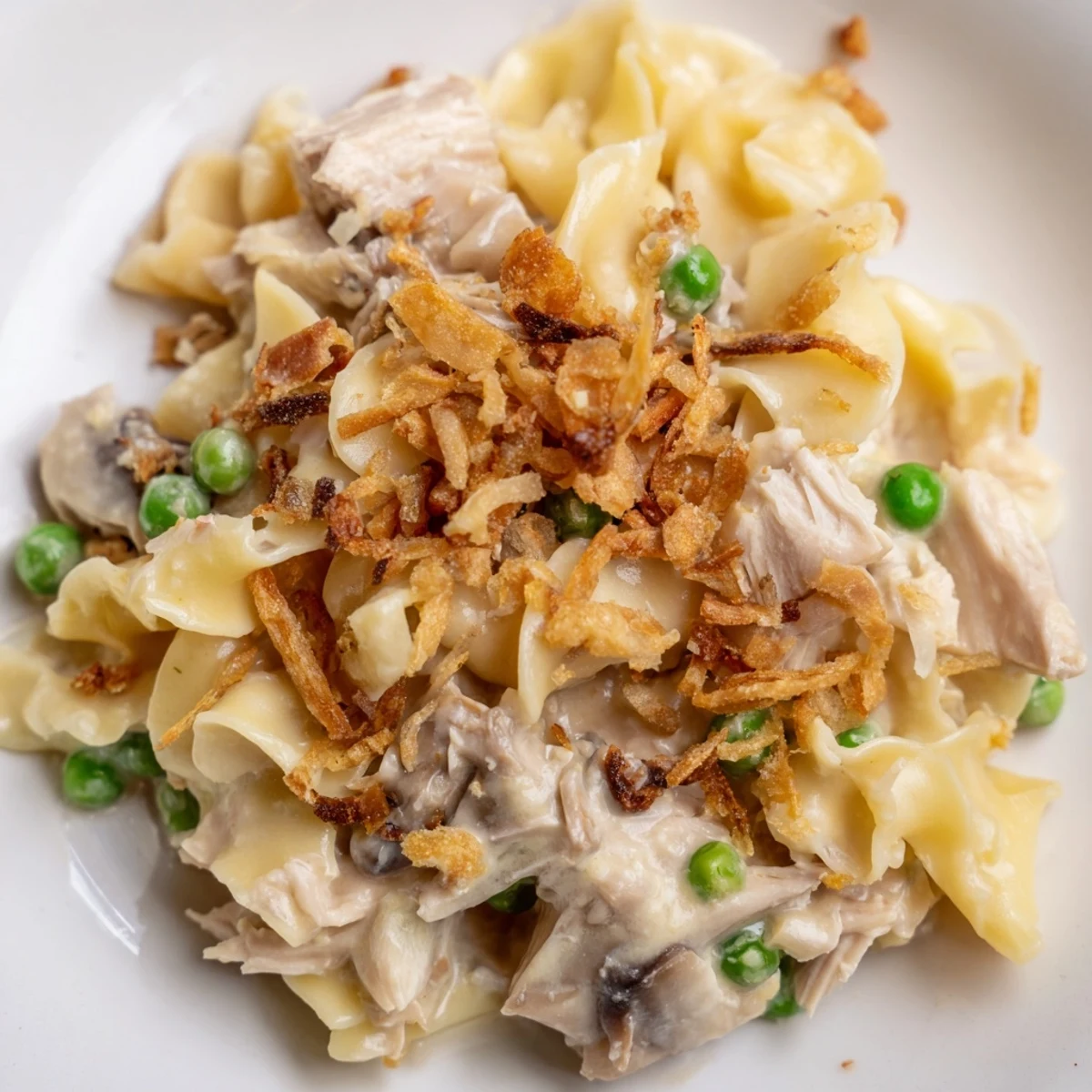 Creamy and golden Tuna Noodle Casserole, a classic comfort food dish, ready for serving.