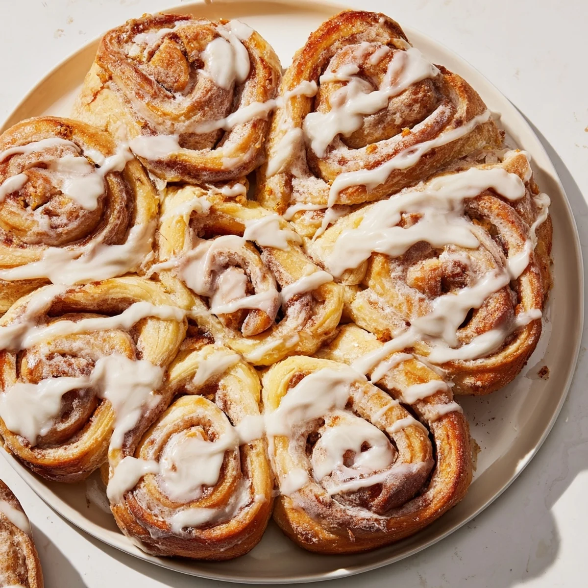 Fluffy, golden-brown Giant Snowflake Sweet Roll Centerpiece arranged beautifully on a baking sheet, ready to glaze.
