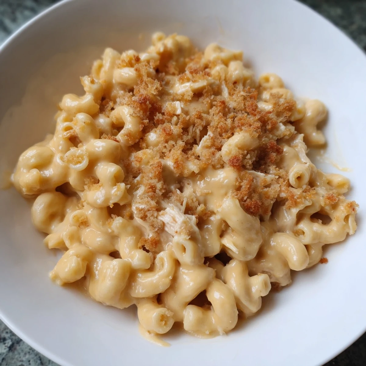 Golden, bubbly Struggle Meal Chicken Macaroni bake with a creamy cheese sauce and breadcrumb topping.