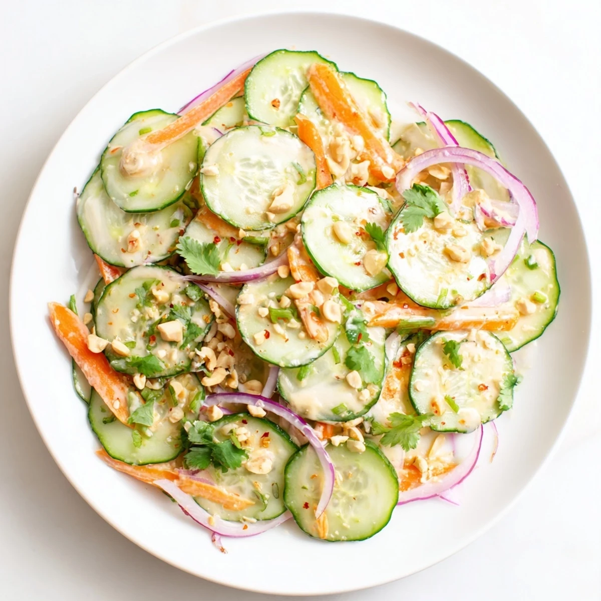Chilled Thai-Style Peanut Cucumber Salad with a zesty, flavorful peanut dressing, ready to enjoy as lunch.