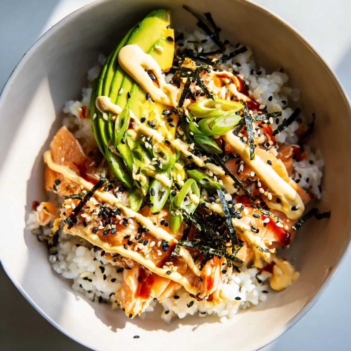 Enjoy the easy textures of the vibrant and flavorful Classic Salmon Rice, served sizzling hot.