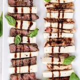 Safari Stripes appetizer: alternating rows of beef, chicken, and mozzarella with balsamic glaze drizzled over.