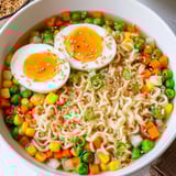 Colorful, steaming Ramen Upgrade with Frozen Peas, featuring vibrant vegetables and savory broth.