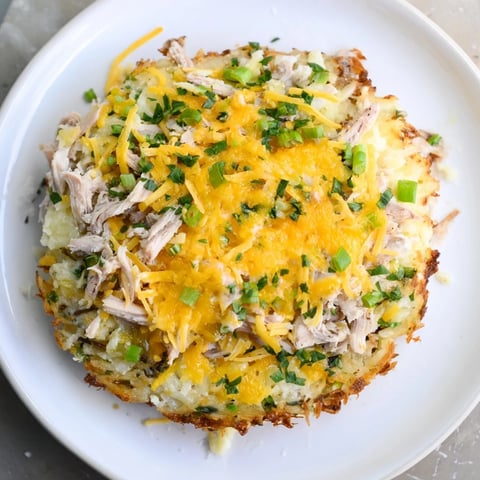 Golden-brown potato and chicken cakes, crispy on the outside, a comforting and savory main course.