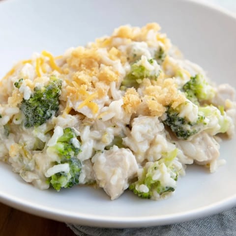 A warm, creamy Chicken & Broccoli Rice Casserole, with cheesy topping, perfect for family dinner.
