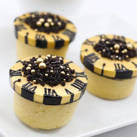 Festive Countdown Clock Mini Desserts with chocolate clock hands; sweet treats perfect for special celebrations.