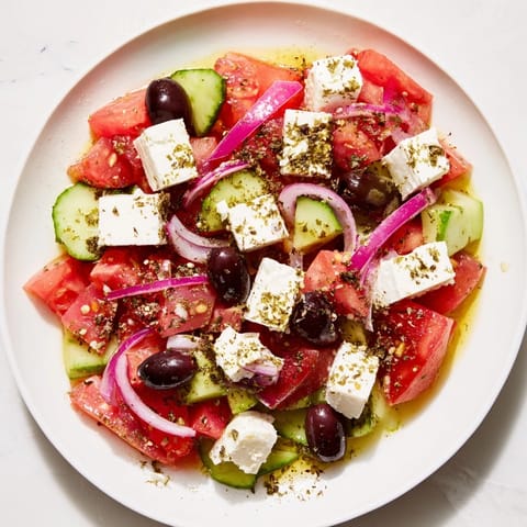 Refreshing Mediterranean salad, a colorful mix of diced vegetables and creamy feta cheese.