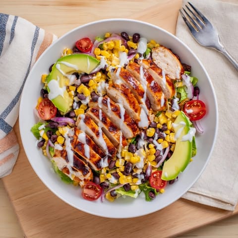 Savory BBQ Chicken Salad features smoky grilled chicken, charred corn, and fresh avocado on crunchy romaine for a hearty main dish.