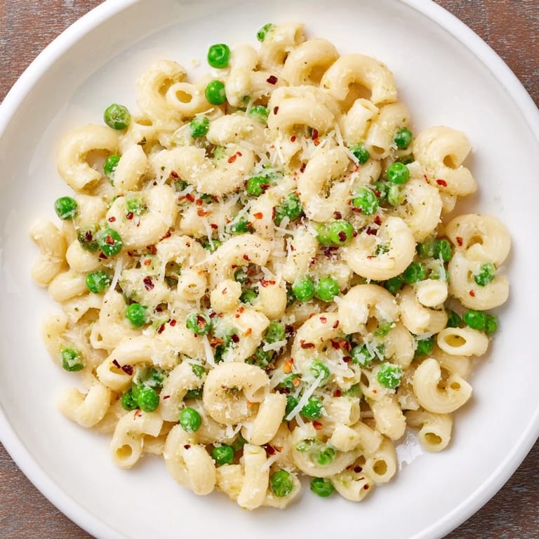 Enjoy a steaming plate of homemade macaroni & peas, perfect for a quick weeknight dinner.